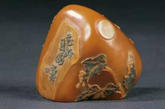 怎样识别乌鸦皮黄蜡石